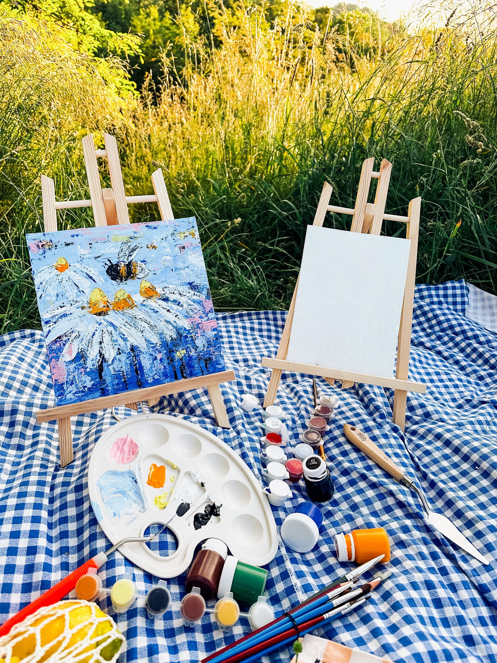 Painting on canvas during a picnic in the park.